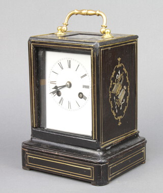 A Victorian 8 day striking carriage clock with enamelled dial and Roman numerals contained in an ebony and inlaid brass case, the sides decorated musical trophies, striking on a gong 