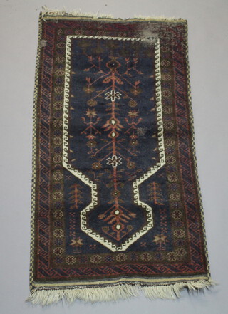 A red, white and blue ground Afghan prayer rug 142cm x 72cm 