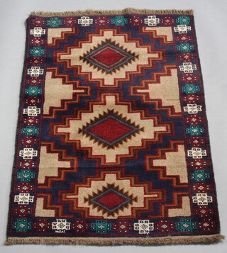 A brown, blue and green ground Belouche rug with 3 stylised medallions to the centre 135cm x 86cm 