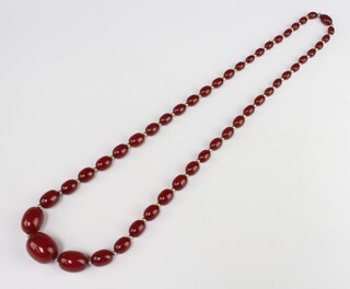 A string of red amberoid beads 80cm 