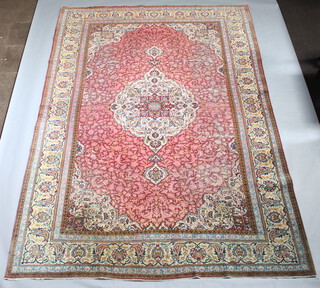 A red and blue ground floral patterned Persian carpet within a 6 row border 390cm x 275cm 