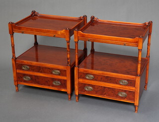 A pair of Georgian style yew rectangular two tier lamp tables fitted a brushing slide and two drawers, raised on turned supports 60cm h x 50cm w x 40cm d 