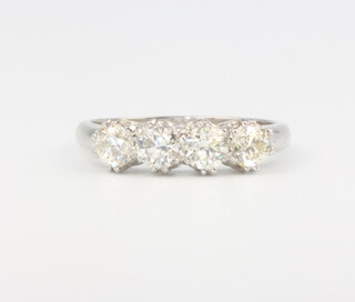A platinum 4 stone diamond ring approx. 1.25ct, size N