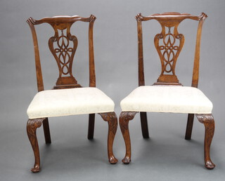 A pair of 19th Century Chippendale style slat back dining chairs with pierced vase shaped slat backs and overstuffed seats, raised on cabriole supports 94cm h x 54cm w x 45cm d (seat 42cm w x 35cm d)  