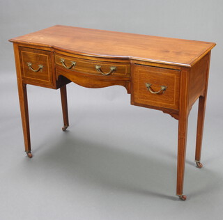 An Edwardian inlaid mahogany bow front side table fitted a frieze drawer flanked by 2 short drawers on square tapered supports, ceramic casters 81cm h x 114cm w x 53cm d 