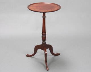 An Edwardian, Georgian style circular mahogany dish top wine table raised on a turned column and tripod base, the column and legs inlaid 68cm h x 36cm diam. 
