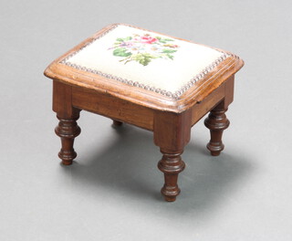 A Victorian rectangular mahogany footstool with floral Berlin wool work seat, raised on turned supports 20cm h x 27cm w x 24cm d 
