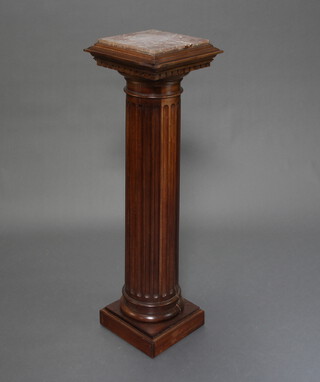 A Victorian bleached and fluted mahogany column with pink veined marble top, dentilled cornice, raised on a square base 113cm h x 32cm w x 32cm d 