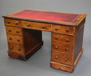 A Victorian oak kneehole pedestal desk with inset leather writing surface above 1 long and 8 short drawers with replacement drop handles 73cm h x 123cm w x 68cm d 