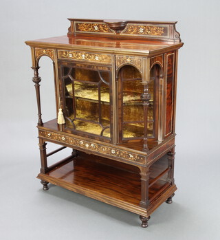 A Victorian inlaid rosewood display cabinet, the raised back enclosed by a bevelled glazed panelled door above a recess supported by square fluted columns 119cm h x 91cm w x 42cm d 
