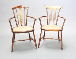 A near pair of Edwardian Art Nouveau beech framed stick and rail back carver chairs raised on turned supports with H framed stretcher 82cm h x 52cm w x 40cm d (seat 31cm x 34cm)  