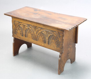 A 17th Century style carved oak coffer of panelled construction with hinged lid 48cm h x 76cm w x 35cm d 