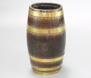 A 19th Century oval fruitwood barrel stick stand 60cm h x 26cm w x 20cm d 
