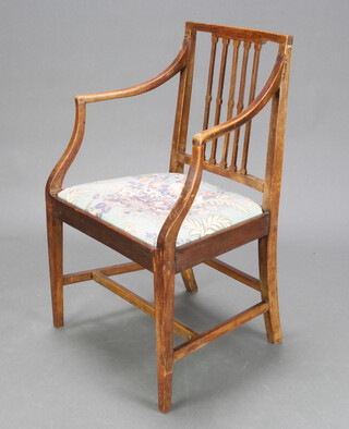 A Georgian bleached mahogany stick and rail back carver chair with upholstered drop in seat 86cm h x 52cm w x 44cm d (seat 36cm x 40cm) 
