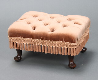 A rectangular mahogany footstool the seat upholstered in buttoned peach material, on cabriole supports 20cm x 29cm w x 29cm d 