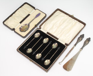 A cased silver and guilloche enamel preserve spoon, 6 bean end coffee spoons, a button hook and shoe horn, weighable silver 42 grams 