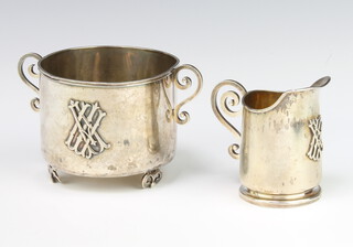 A Russian silver 2 handled sugar bowl and cream jug with cut monogram, 304 grams
