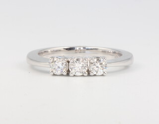 An 18ct white gold 3 stone brilliant cut diamond ring, approx. 0.5ct, size N, 5 grams