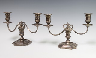 A pair of 2 light silver candlesticks with scroll arms, Birmingham 1934, weighted, gross weight 1800 grams 19cm 