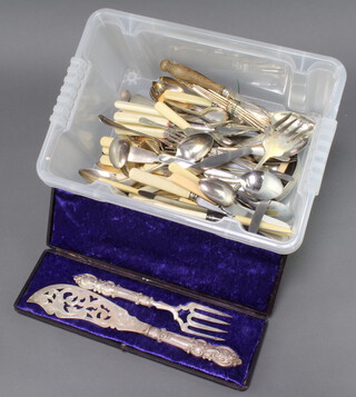 A cased pair of plated Victorian fish servers and a quantity of plated cutlery 