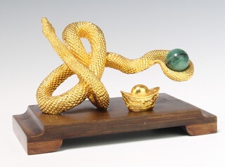 A gold plated model of a snake raised on a wood stand 22cm, boxed