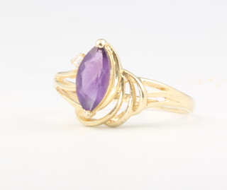 A lady's 14ct yellow gold amethyst and diamond scroll ring, 2.5 grams, size Q 