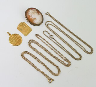 Two middle Eastern yellow metal pendants 2 grams together with a silver mounted cameo and 2 necklaces 