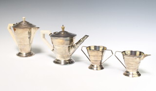 An Art Deco 4 piece silver tea set with ivory mounts, Sheffield 1934 and 1935, 1080 grams gross