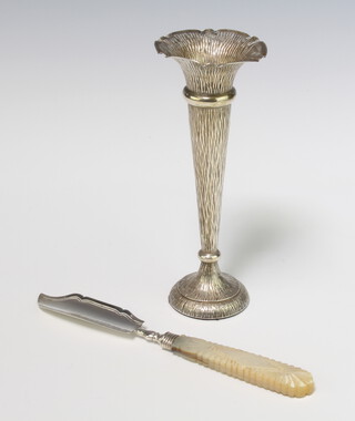 An Edwardian bark finished silver tapered posy vase Chester 1908 17cm, weighted, together with a silver handled butter knife 