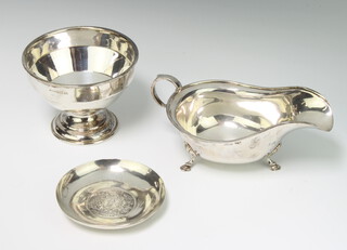 A silver sauce boat Sheffield 1932, a coin set dish and a pedestal bowl 236 grams 