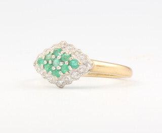 A 9ct yellow gold emerald and diamond cluster ring, 2.4 grams, size O 