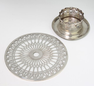 A pierced silver candle holder London 1915, 88 grams, 10cm, together with a silver overlaid glass stand 15cm 