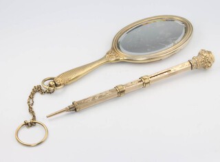 A 19th Century Continental silver gilt mirror 13cm and a ditto propelling pencil 