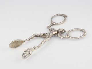 A pair of novelty silver figural sugar tongs in the form of an acrobat 10cm, 32 grams 