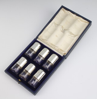 A cased set of 6 silver mounted peppers, London 1868, 6cm 