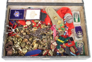 A silver and enamelled sports fob, 3 bronze medallions, 4 silver scout badges, a quantity of military buttons and cloth badges 