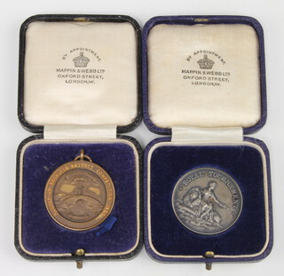 A 1933 silver Royal Tournament medallion and a bronze ditto, cased