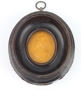 A carved amber oval portrait miniature of Oliver Cromwell dated 1650, signed O B  5.5cm x 4.5cm 