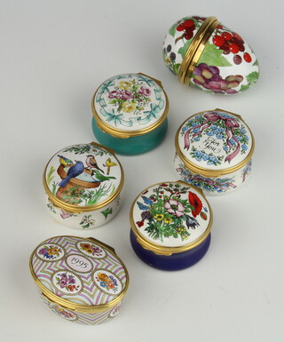 A Halcyon Days enamelled egg decorated with fruits 6cm, 4 ditto pill boxes and a Bilston and Battersea ditto 