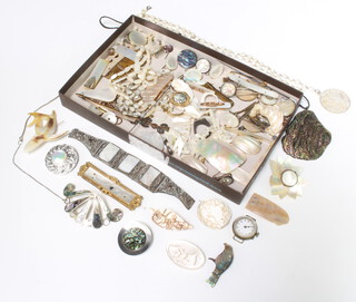 A quantity of mother of pearl mounted jewellery including brooches, pins, watches, clips etc

 