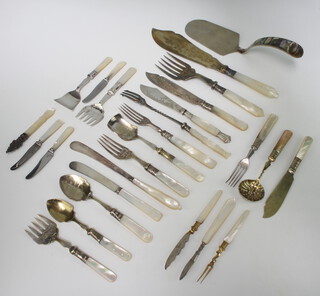 A quantity of mother of pearl mounted cutlery 