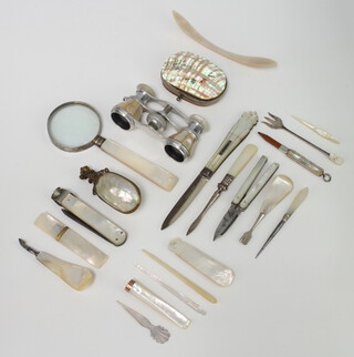 A pair of mother of pearl mounted opera glasses, a silver mounted fruit knife and other decorative items