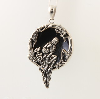 A sterling silver Art Nouveau style pendant decorated with a figure, 5cm, 15 grams 