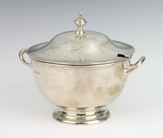 A circular silver tureen and cover with twin handles 525 grams, 16cm, Sheffield 1933 