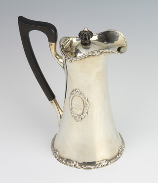 An Edwardian silver hot water jug with cast floral borders and engraved armorial, London 1901, 17cm, gross weight 440 grams 