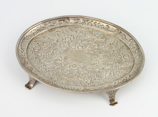 A William IV silver oval stand profusely decorated with flowers on scroll feet, 16cm, 140 grams 