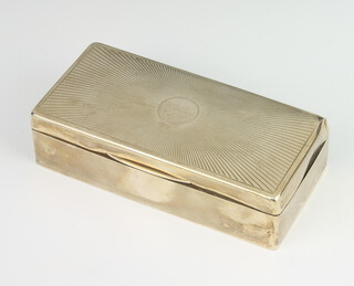 A rectangular silver cigarette box with engraved decoration Birmingham 1925, 18cm 