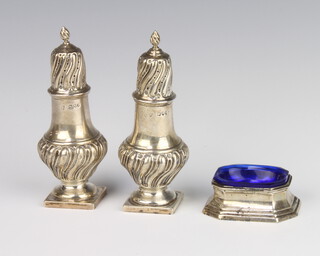 A pair of Victorian silver demi-fluted peppers London 1893, a silver table salt 246 grams 