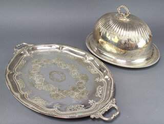 An Edwardian silver plated 2 handled tray 65cm, an oval meat dish and a meat cover 