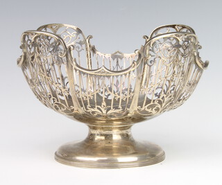 A silver pierced bowl decorated with scrolls and swags Sheffield 1911, 21cm, 600 grams 